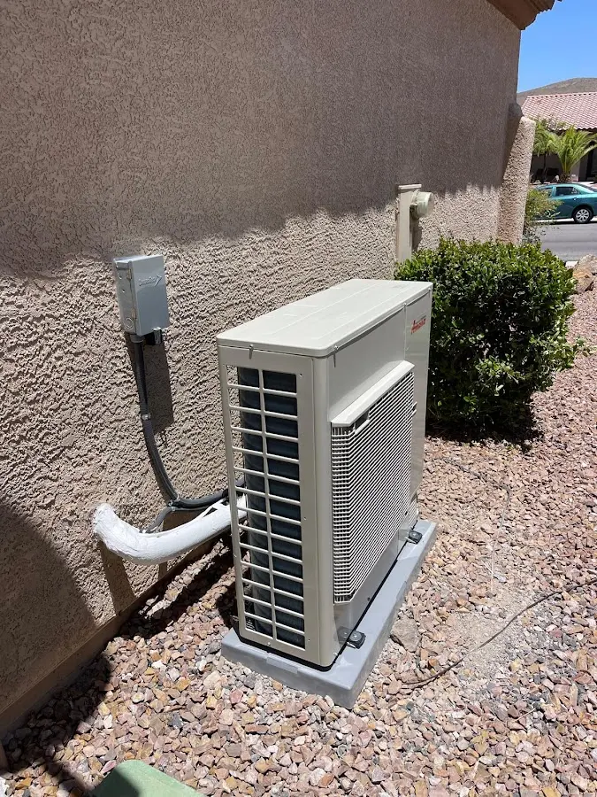 Residential air conditioning condenser unit in Perry